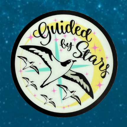 A round glow-in-the-dark sticker of shearwaters flying with a compass and starts and moon in the background and the words, "Guided By Stars"