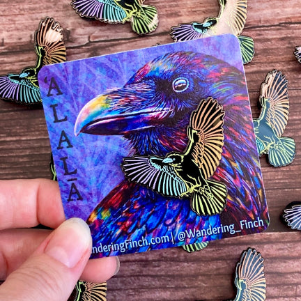 'Alala, or Hawaiian crow enamel pin in rainbow design.