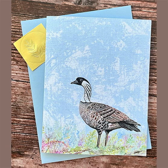 Greeting card with a Hawaiian nene goose illustration on a blue background, plus envelope.