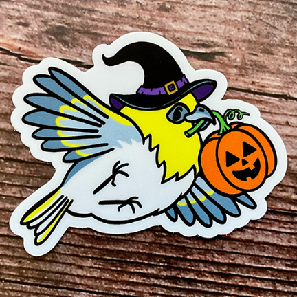 Sticker with an illustration of a yellow native Hawaiian palila bird dressed for Halloween with a witch's hat and flying with a jack-o-lantern in its beak.