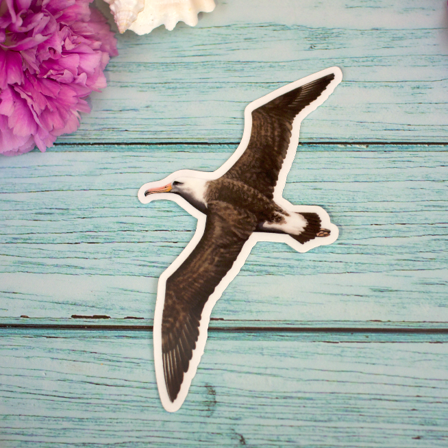 A sticker illustration of a mōlī (Laysan albatross) flying.