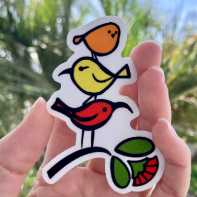 Sticker with three native Hawaiian forest birds stacked on top of each other and standing on an ohia lehua branch.